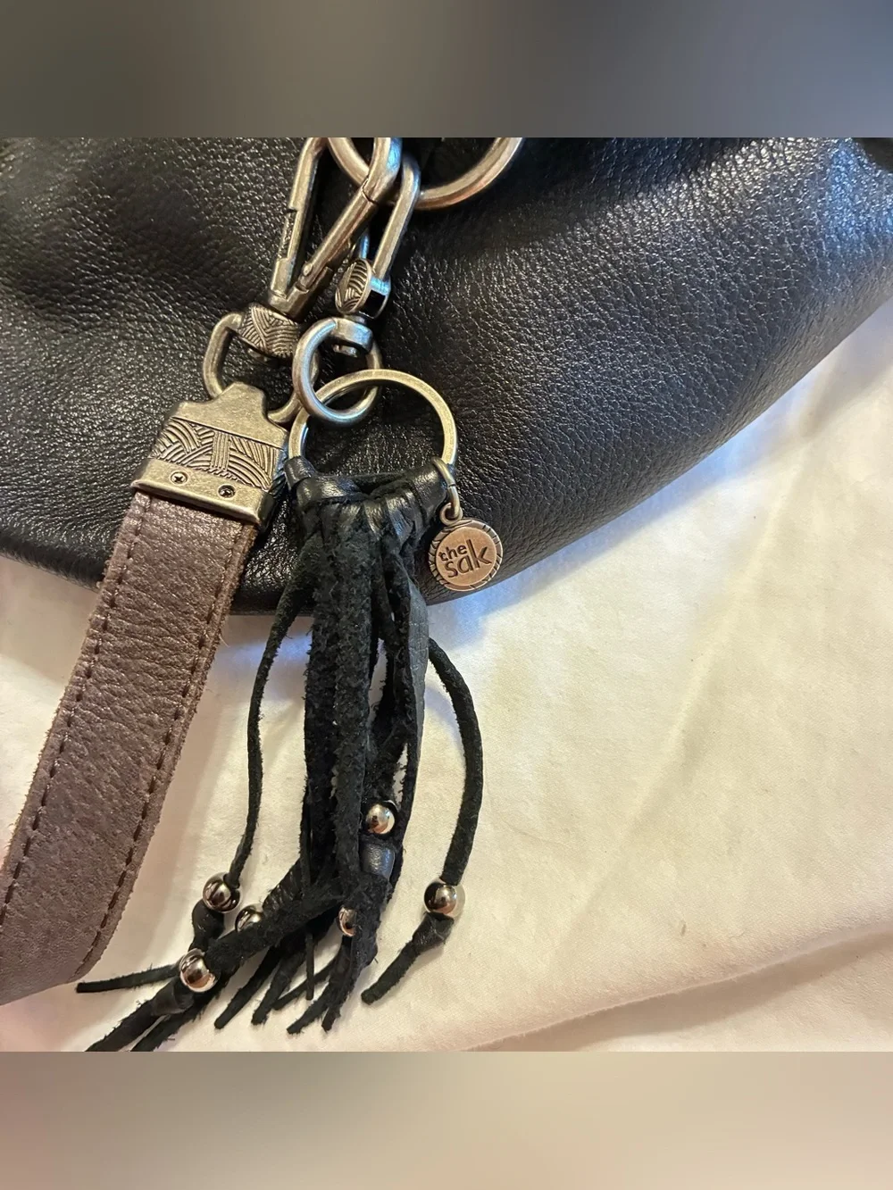 The Sak Black Leather Hobo with Brown Strap Details